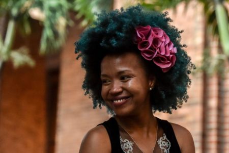 A girl shows an Afro-Colombian hairstyle during the 13th Afro Hairdressers Competition "Tejiendo Esperanzas" (Weaving Hope) in Cali, Valle del Cauca Province, Colombia, on July 2, 2017. The competition seeks to revive Colombia's African customs, identity and culture.  / Photo by AFP / Luis Rubio
