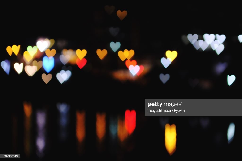 Defocused Image Of Colorful Heart Shape Lens Flares At